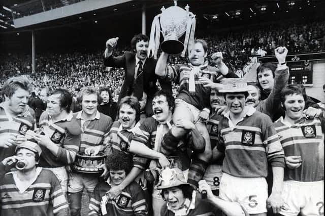 Coach Syd Hynes, in dark suit, celebrates with the Leeds team after their Challenge Cup final win at Wembley in 1978. Picture by Steve Riding.