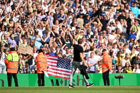 Jesse Marsch celebrates with Leeds fans after the final whistle of the Premier League match between Leeds United and Chelsea FC at Elland Road on August 21.
