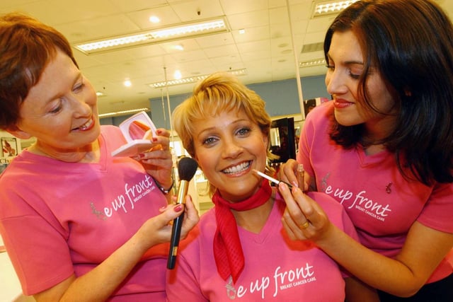 Actress Malandra Burrows enjoyed a makeover to support the Boots Makeover Marathon at the retailer's city centre store in September 2003. She is  pictured with No 7 consultants, Christine Weathers, left and Onessa Sarwar.