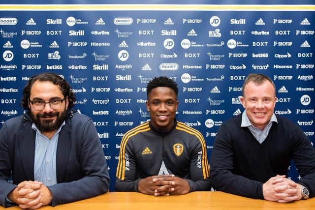 Luis Sinisterra (C) poses beside director of football Victor Orta (L) and chief executive Angus Kinnear (R) (Image: Leeds United)