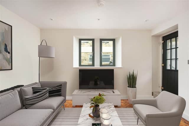 This superb family space leads through to two spaces, which could easily be utilised as a snug and home office.