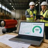 FlexiHeat UK staff analyse web-traffic and efficiency metrics beside a portable heater, underscoring the firm’s partnership with Digitaleer to amplify its online reach and promote energy-saving solutions.