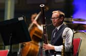 A musician from the Scarborough Spa Orchestra plays in the summer season