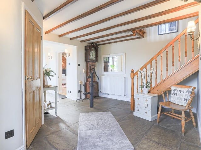 Nestled within beautifully landscaped gardens, this incredible property effortlessly blends period charm with modern comfort.