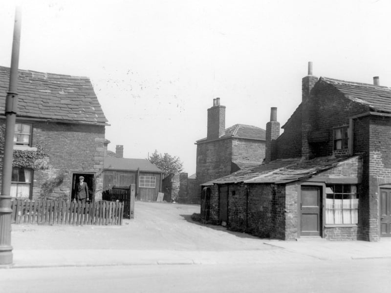 Old cottages and outhouse on Town Street in June 1938.