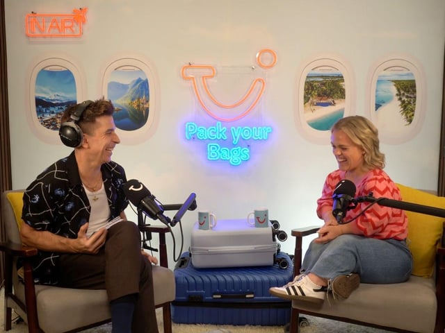 Russell Kane shares a laugh with Ellie Simmonds as they talk travel on Pack Your Bags podcast