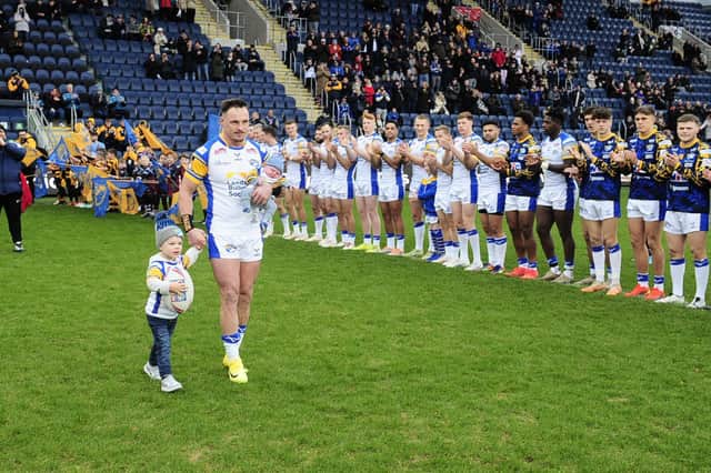James Donaldson is applauded on to the field by both teams ahead of his testiomonial game for Leeds Rhinos against Hull KR. Picture by Steve Riding.