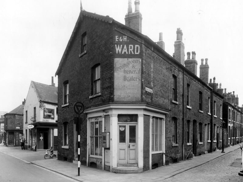 Accommodation Road is on the left, Nippet Terrace has an off-licence shop on the corner which was number 82 Accommodation Road. Next right is number 78, a greengrocers business run by E. and Harold Ward. This is the corner with Nippet Street, which is on the right.