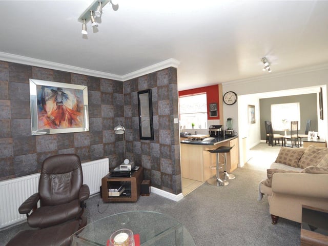It is a stylishly designed space perfect for relaxing or entertaining guests.