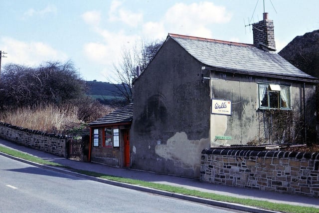 Howley Beck Cottage at the bottom of Scotchman Lane lies beside the stream which formed the boundary between Morley and Batley when this picture was taken, and is now the border between Leeds and Kirklees. The cottage was used as a shop at this time especially for passing trade in ice cream, pop, cigarettes and sweets for people walking in the area.