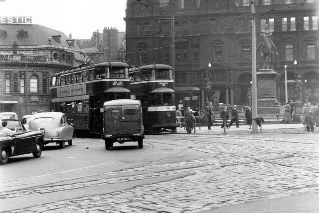 Tram no 561 on route 18 Cross Gates with tram on route 16 to New Inn Wortley also visible. Photograph taken at City Square in July 1956. Post Office and Majestic cinema and ballroom can also be seen.
