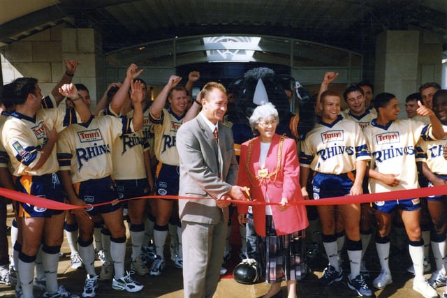 Councillor Linda Middleton, Lord Mayor of Leeds, and Leeds Rhinos head coach Dean Bell, open the Cookridge Hall Golf and Country Club on Cookridge Lane in September 1997, watched by Leeds Rhinos' players.