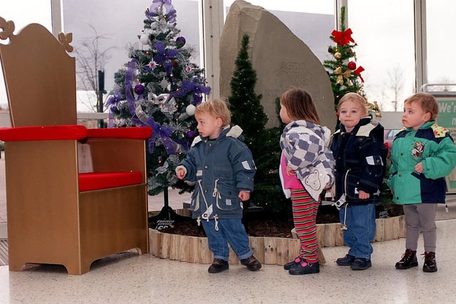 November 1999 and Christopher Wilson, Emily Underwood, Andrew and Emily Wilson look expectantly at Santa's chair at Asda's Owlcotes store. The store has advertised unsuccessfully for a Father Christmas.