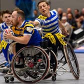 Leeds Rhinos' Nathan Collins evades a tackle by fellow England star Jack Brown, of Halifax Panthers, in the Betfred Wheelchair Super League Grand Final. Picture by Allan McKenzie/SWpix.com.