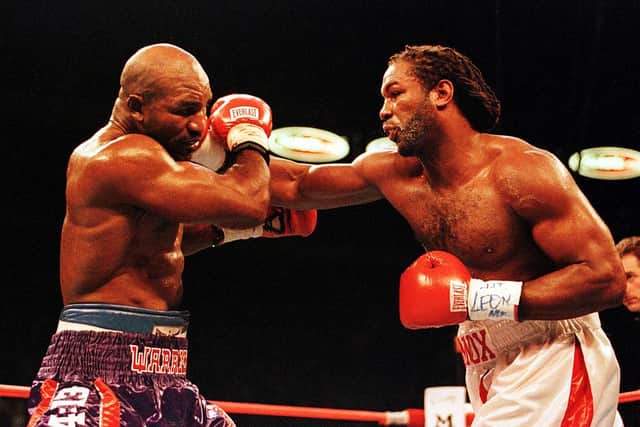 Lennox Lewis (R) and Evander Holyfield trade blows during their World Heavyweight Championship unification fight in Las Vegas, Nevada in November 1999. Lewis won the fight by a unanimous decision (Photo: Al Bello/ALLSPORT/Newsmakers)
