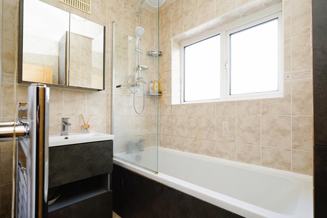 The house bathroom is fitted with a modern suite, and a separate toilet is down the hall.