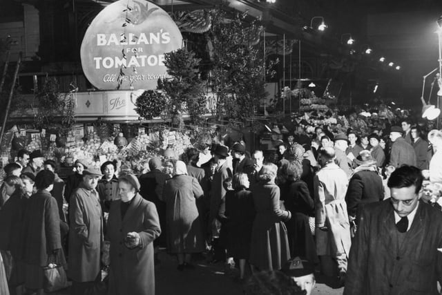 A busy Ballans fruit and veg stall in Kirkgate Market in December 1951.