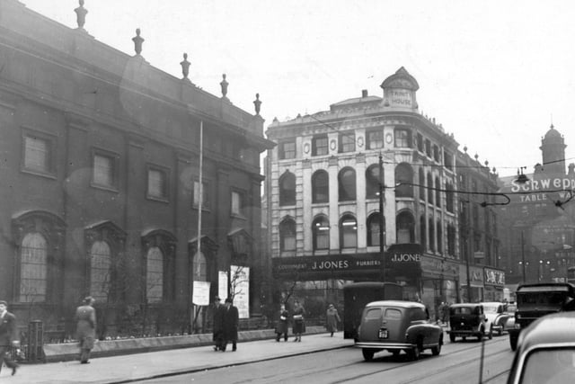 Boar Lane in March 1956 showing Holy Trinity Church and J. Jones, Furriers.