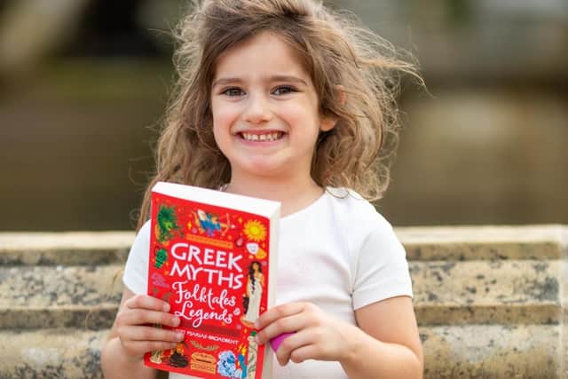 Vicki's daughter Florence with her book. Photo: Peter Broadbent