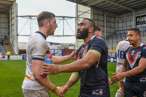 Trinity's Samisoni Langi, seen shaking hands with England centre Jake Wardle, picked up a knock playing for France last weekend. Picture by Olly Hassell/SWpix.com.