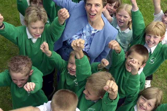 Headteacher at Whitecote Primary Kirsty Mitchell and pupils celebrate excellent Ofsted report. Pictured in July 2003.