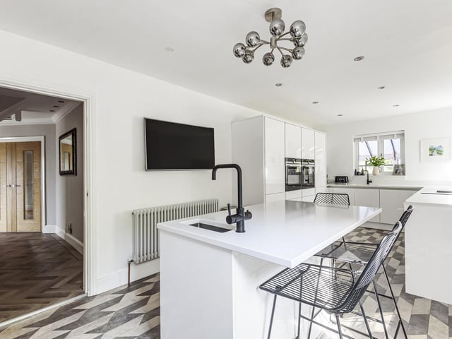 A new kitchen and diner is fitted with high specification appliances, and there is also a home office and a downstairs toilet.