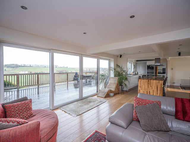 Adaptable living space that opens out on to the expanse of raised decking that looks out over the river.