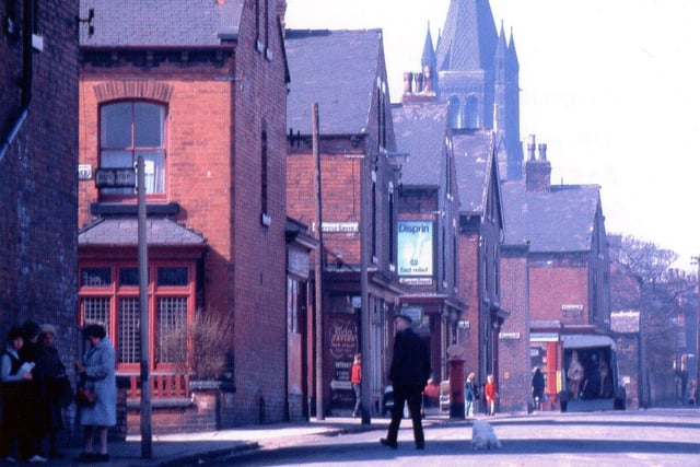 A view along Hall Lane with the junction with Mitford Terrace to the left. Moving along Hall Lane the other streets are Simpson Grove, Simpson Street, Gledhow Street, Fearnley Street and Fitz Arthur Street where the butcher's delivery van is parked. Pictured in April 1969.
