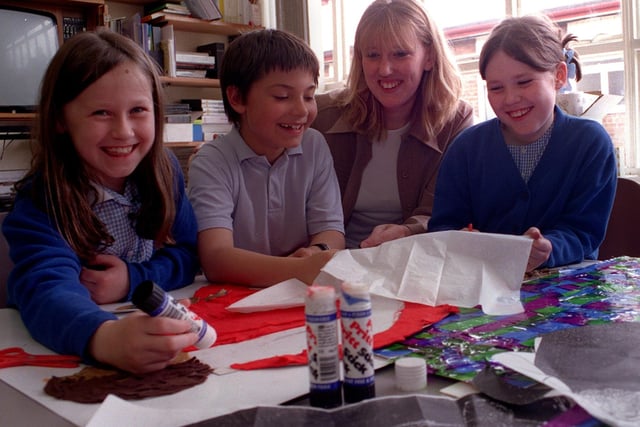 St. Paul's Primary School teacher Claire Armitage supervises an art group in June 1999. Pictured, from left, are Hannah Cooney, Adam Lesiak and Emily Kent.