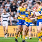 Joe Shorrocks, left, congratulates Morgan Gannon on his try for Leeds Rhinos in the 34-0 win at Hull FC. Picture by Allan McKenzie/SWpix.com.