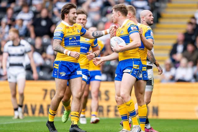 Joe Shorrocks, left, congratulates Morgan Gannon on his try for Leeds Rhinos in the 34-0 win at Hull FC. Picture by Allan McKenzie/SWpix.com.