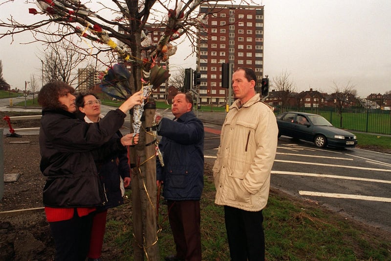 Road safety campaigners lay flowers on the year anniversary in Febraury 1997 when 9-year-old Wayne Rigby was killed crossing Oak Tree Drive. Pictured are Margaret Ferguson , Margaret  and Keith Beaumont and Leroy Ferguson.