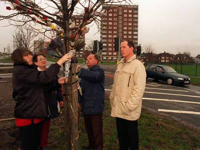 Road safety campaigners lay flowers on the year anniversary in Febraury 1997 when 9-year-old Wayne Rigby was killed crossing Oak Tree Drive. Pictured are Margaret Ferguson , Margaret and Keith Beaumont and Leroy Ferguson.
