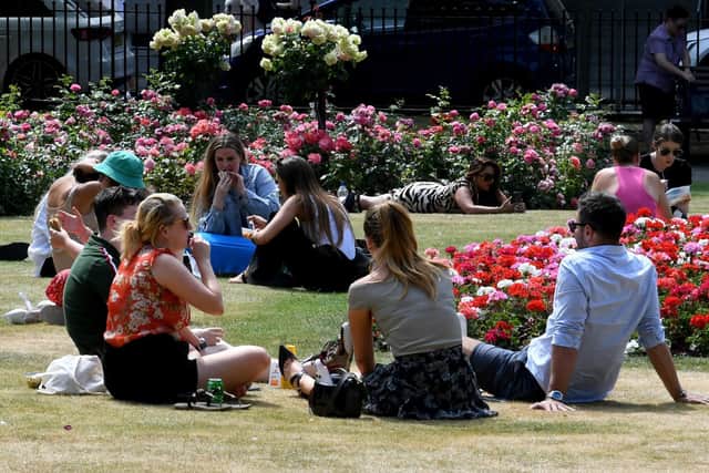 People will be enjoying the sunshine in Park Square as the warm weather continues. Picture: Simon Hulme.