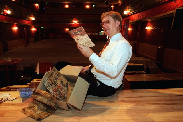 Peter Sandeman, general manager at City Varieties, reads through old programmes found during a recent refurbishment of the theatre.