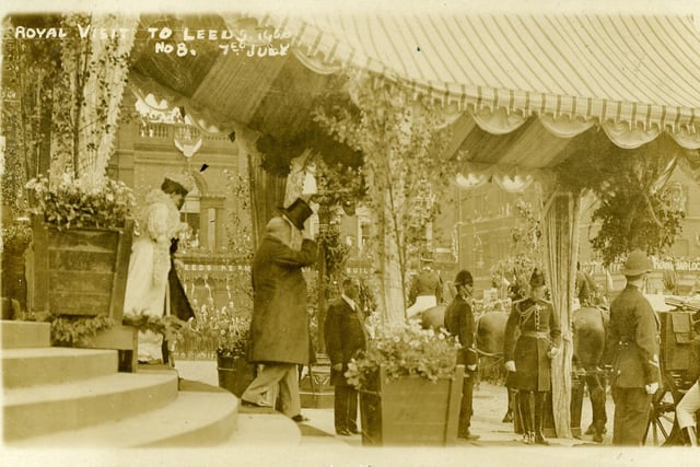A postcard titled 'Royal Visit to Leeds No.8 7th July', showing King Edward VII and Queen Alexandra walking down the Leeds Town Hall steps under a canopy towards their carriage.