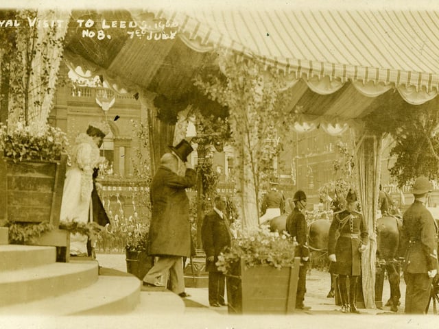 A postcard titled 'Royal Visit to Leeds No.8 7th July', showing King Edward VII and Queen Alexandra walking down the Leeds Town Hall steps under a canopy towards their carriage.