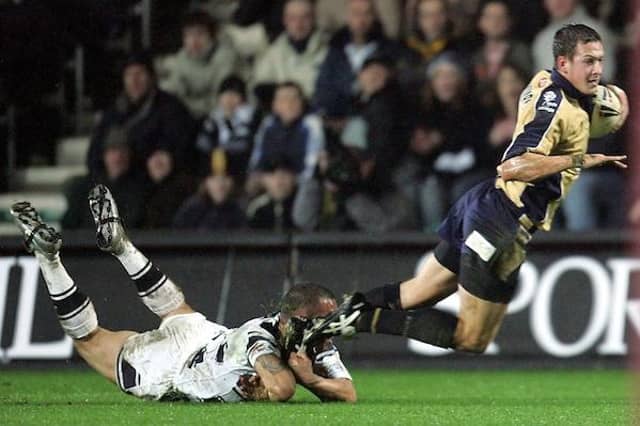Danny McGuire is tackled by Nathan Blacklock during Rhinos' Super League opener at Hull on February 11, 2005. Picture by John Clifton/SWpix.com.