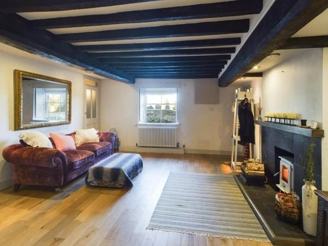 The 'spacious but cosy' lounge, with logburner.
