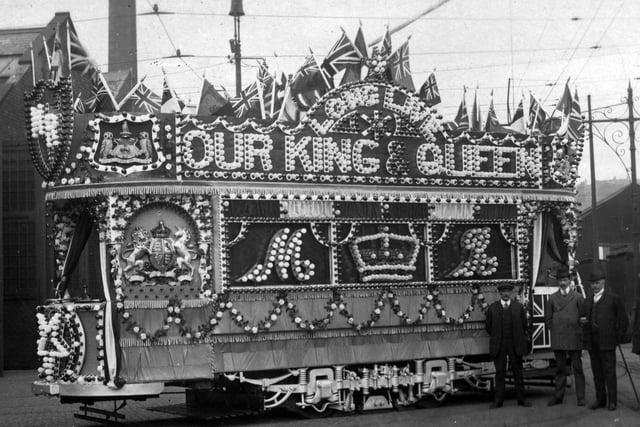 A heavily illuminated tramcar, created to celebrate the coronation of King George V. The photograph was most likely taken at Kirkstall Tram Works. Pictured in June 1911.