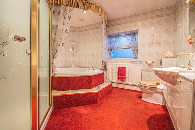 A luxurious bathroom with jacuzzi style bath within its suite.