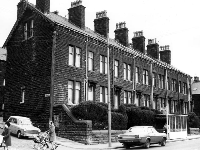 Two women are pictured pushing prams across Ashdown Street at the corner with Stanningley Road in March 1973.