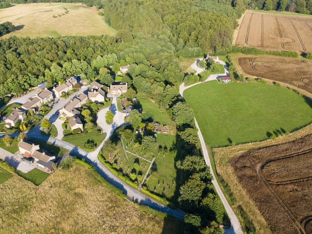 The village includes 900 square miles of turf, which is maintained by a full-time gardener, and as the show is filmed six weeks in advance of airing the production team ensures plants in the village are in flower at the correct time. In order to achieve this, bulbs are nurtured in greenhouses before being planted outside.. Pic: Rotor Aerial Photography/ITV Studios/PA Wire