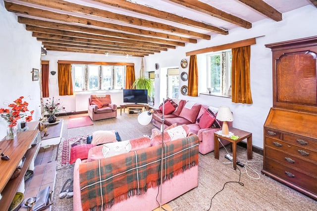 Original ceiling beams and stone mullions to the windows add to the charm of this spacious lounge.
