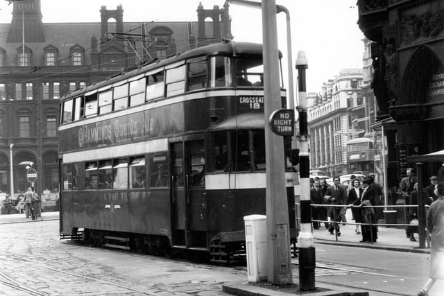 Tram no 561 at Boar Lane City Square Junction route 18 to Cross Gates. Royal Chambers can be seen on right of General Post Office visible in the background. Pictured in July 1956.