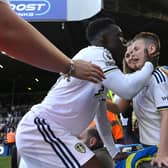 EMOTIONAL SCENES - Leeds United winger Willy Gnonto consoles a young fan after the club's relegation to the Premier League. Pic: Getty