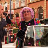 Dame Edna Everage is given a warm welcome by Leeds Grand Theatre general manager Warren Smith as she arrives in the city to promote a series of shows.