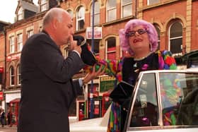 Dame Edna Everage is given a warm welcome by Leeds Grand Theatre general manager Warren Smith as she arrives in the city to promote a series of shows.