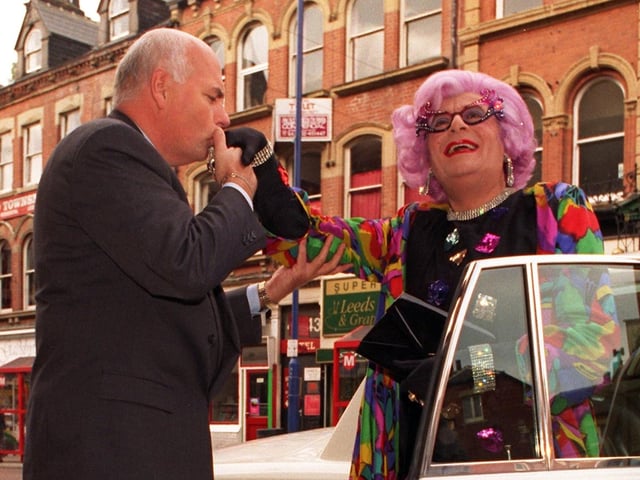 Dame Edna Everage is given a warm welcome by Leeds Grand Theatre general manager Warren Smith as she arrives in the city to promote a series of shows.