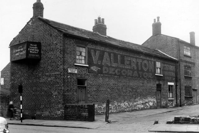 This view looks from Green Lane onto Wortley Grove, the former location of two businesses. V. Allerton, decorator had occupied number 3, with number 5 on the right edge being the West Leeds Printing Works, business of J. Rostron and Son Ltd. Number 1 is a private residence. Pictured in May 1959.